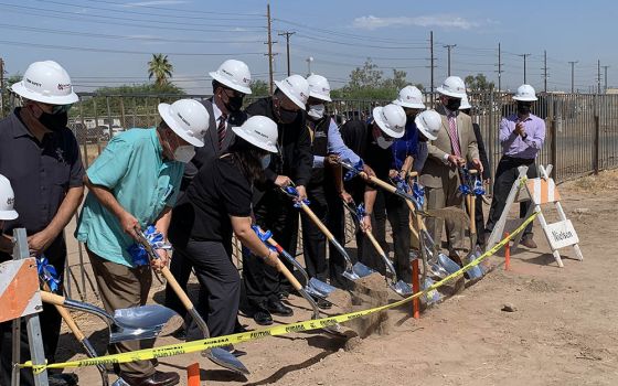Catholic faith leaders and other local leaders break ground on the El Centro Homeless Day Center in Imperial County in Southern California on Aug. 30. (NCR photo/Melissa Cedillo)