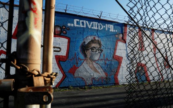 A mural of a health care worker is seen in Chicago April 21 during the coronavirus pandemic. "My conversations with local officials is simply this: Tell us what you need, and we'll see what we can do," says Chicago Cardinal Blase Cupich. (CNS/Reuters)
