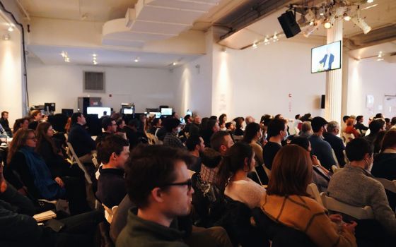 Attendees listen to speakers David Brooks and Francis Collins Feb. 19 during New York Encounter at the Metropolitan Pavilion in New York. The annual cultural event organized by the Communion and Liberation lay movement. (Mariagustina Fabara Martinez)