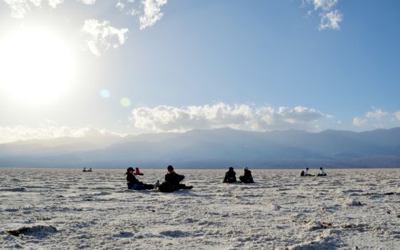 University of Scranton Students practice reflective listening deep within Badwater Basin in Death Valley National Park on A Desert Experience Retreat in December 2017. (Luis Melgar)