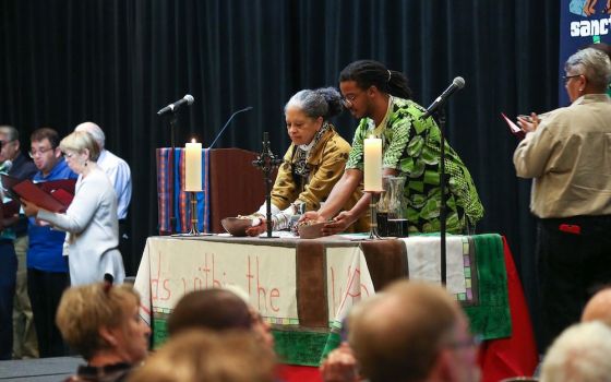 Derek Rankins, left, and Debra Brittenum participate in liturgy at the 2018 Call to Action national conference in San Antonio, Texas. (Call to Action)