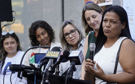 Jennifer, a migrant from Venezuela who is seeking asylum in the U.S., speaks during a news conference outside the Archdiocese of New York's headquarters in New York City Aug. 16, 2022.
