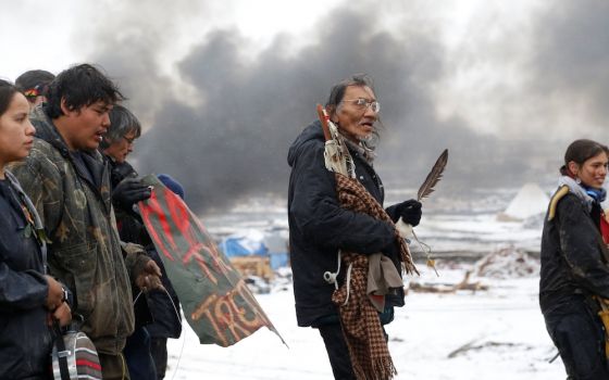 Native American protesters march against the Dakota Access oil pipeline near Cannon Ball, North Dakota, in January 2019. Appointment of a Native American interior secretary could change the government's relationship with the country's original peoples. (C