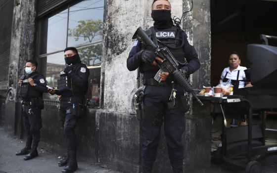 Heavily armed police guard the streets as part of a state of exception in downtown San Salvador, El Salvador, March 27, 2022.
