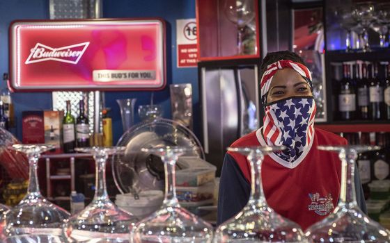A bartender wears a face mask to protect against COVID-19 at the Mustang Sally Restaurant in Pretoria, South Africa, on Nov. 4, 2020, the day of the U.S. presidential election. (AP)