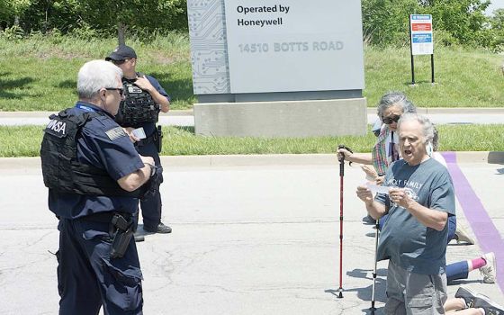 Moments after Tom and Hoa Fox crossed a purple line marking a private entrance to the Kansas City, Missouri, nuclear weapons manufacturing plant, called a "National Security Campus," police moved in to detain them. (Courtesy of Jeff Davis)