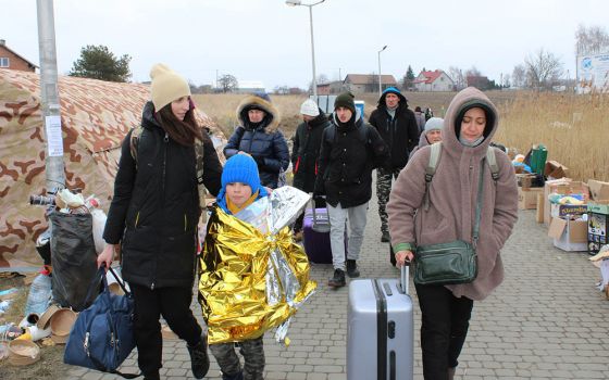Ukrainian refugees after crossing the Ukrainian-Polish border near Przemyśl, Poland (NCR photo/Chris Herlinger)