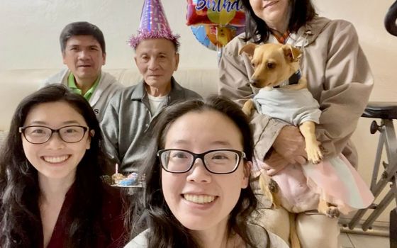 Writer Theresa La, center, with family members, from left: sister Lucia, her uncle, grandfather, mother and dog Bailey (Courtesy of Theresa La)