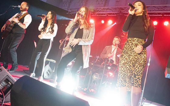 Musicians peform during an Array of Hope event. From left, front row, are Dan Ferrari, Lauren Costabile, Brianne Nealon, and Nicky Costabile; in the back row are Jack Garno on guitar and Jimmy Meier on drums. (Courtesy of Array of Hope/Jeffrey Bruno)