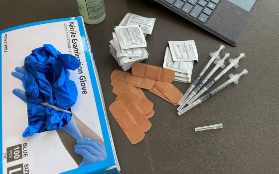 Syringes and gloves are pictured on the campus of the University of Memphis in Tennessee July 22, as students receive COVID-19 vaccines. Boston College requires all students and faculty be vaccinated for COVID-19. (CNS/Reuters/Karen Pulfer Focht)