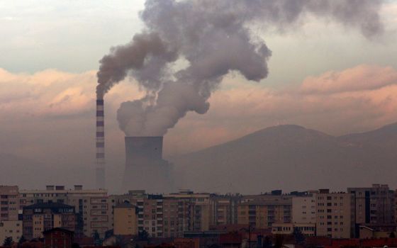 Smoke and steam rise from a coal-fired power plant in Obilic, Kosovo, in 2019. (CNS photo/Ognen Teofilovski, Reuters)