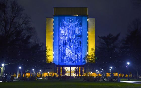 The University of Notre Dame's Hesburgh Library Word of Life mural is lit in the colors of the Ukrainian flag in solidarity with the people of Ukraine on March 18. (University of Notre Dame/Matt Cashore)