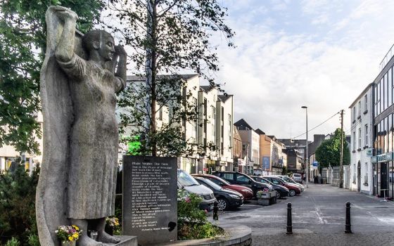 Near a former Magdalene laundry in Galway, Ireland, a memorial with a sculpture by Mike Wilkins and a plaque with a poem by Patricia Burke Brogan honors the women who were held such institutions. (Flickr/William Murphy)