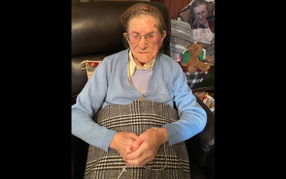 Nancy Stewart seen with her rosary beads inside her house in Clonard, County Meath, Ireland (Courtesy of Louise Coghlan)