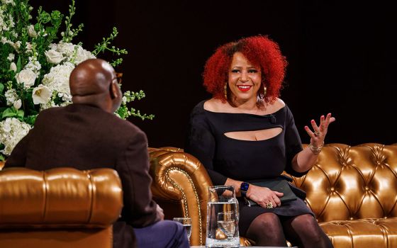 Journalist Nikole Hannah-Jones speaks at the University of Notre Dame in Notre Dame, Indiana, March 15. Mark Sanders, a professor of English and Africana studies, is at left. (University of Notre Dame/Peter Ringenberg)
