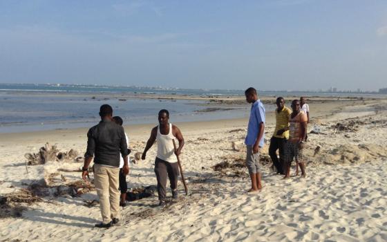 Catholic young people in Dar es Salaam, Tanzania, clean a section of the beach on the Indian Ocean in 2016. (Allen Ottaro)