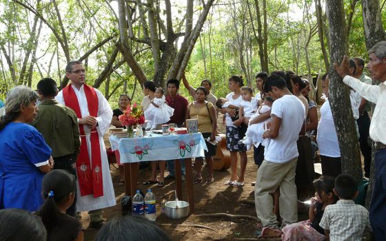 Vincentian Fr. Flavio Tercero leads a Mass and baptism for a community near El Naranjo, at the border between Guatemala and Mexico. Tercero repeated to NCR what so many involved with Guatemalan communities insist is key to addressing root causes of migrat