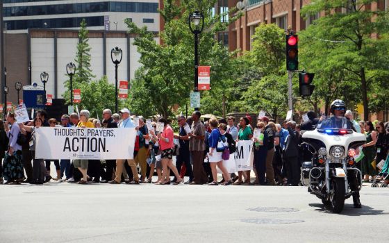 Hundreds of attendees at the ELCA Churchwide Assembly march to the ICE building in Milwaukee, Wis., for a prayer vigil in support of migrant children and their families on Aug. 7, 2019. (RNS photo/Emily McFarlan Miller)