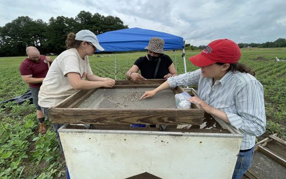 Jesuit Br. Ken Homan; Colleen Betti, field technician and Ph.D. candidate; Robin Proudie, a Missouri descendant; and Laura Masur, professor of the Catholic University of America at the plantation dig site at St. Inigoes in Maryland (Kevin Porter)