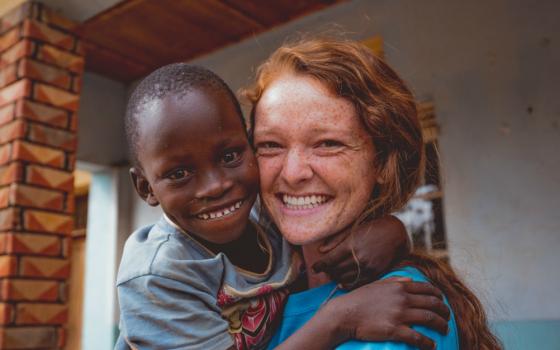 Rannah Evetts, founder of the St. Francis de Sales School for the Deaf in Uganda, enjoys a moment with one of her students. (Courtesy of St. Francis School for the Deaf)