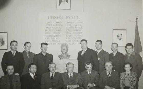 Grace Holmes Carlson (front row, far right) poses with 14 of the 18 activists convicted of trying to overthrow the government under the 1940 Smith Act. Carlson went to prison in 1943. (Minnesota Historical Society, CC BY-SA 3.0)