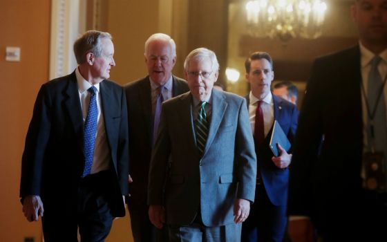 Senate Majority Leader Mitch McConnell, R-Kentucky, center, is seen with fellow Republican senators Jan. 16 at the U.S. Capitol in Washington. (CNS/Reuters/Jonathan Ernst)