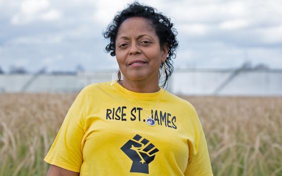 Sharon Lavigne, the 2021 Goldman Environmental Prize winner for North America, in front of oil storage tanks in St. James Parish, Louisiana (Courtesy of Goldman Environmental Prize)