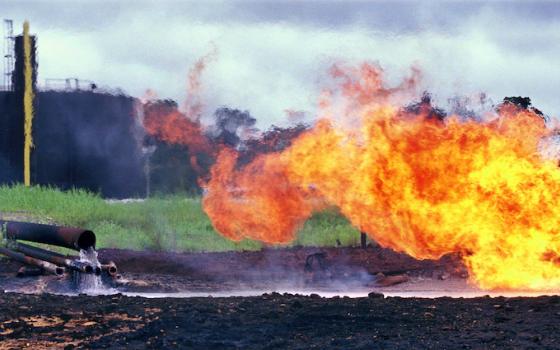 Oil waste pit fire in 1993 at a facility in Shushufindi, Ecuador, built by Texaco, which later merged with Chevron. (Courtesy of Steven Donziger)