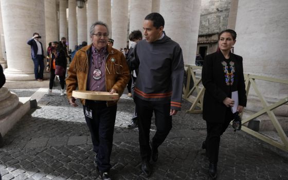 From left, Gerald Antoine, First Nations NWT regional chief, Natan Obed, president of Inuit Tapiriit Kanatami delegation, and Cassidy Caron, president of the Metis community, walk in St. Peter's Square, at the Vatican, after their meeting with the pope.