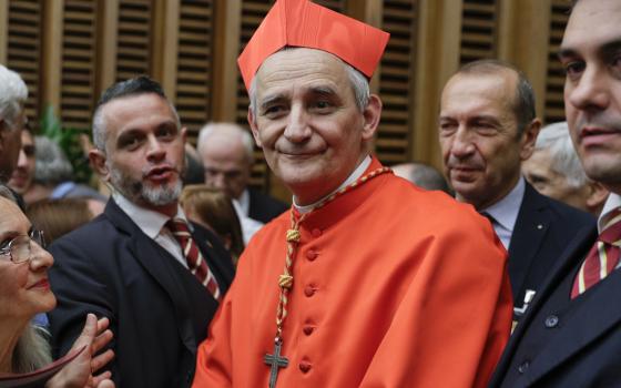 Cardinal Matteo Zuppi poses for photographers at the Vatican, Saturday, Oct. 5, 2019. (AP Photo/Andrew Medichini, File)