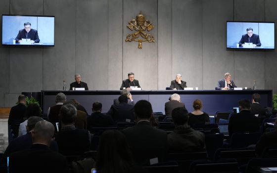 From left, Professor Gianfranco Ghirlanda, Mons. Marco Mellino, Cardinal Marcello Semeraro, and Vatican's spokesman Matteo Bruni, attend the presentation of the long-awaited reform program of the Holy See bureaucracy, during a press conference at the Vati