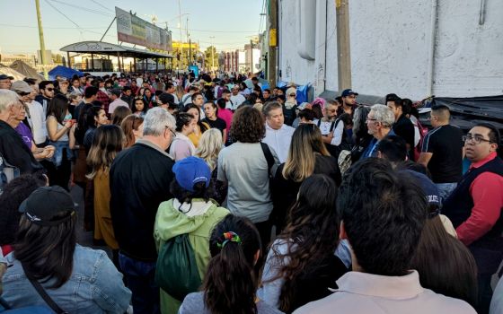 Catholic activists gather at the U.S.-Mexico border in El Paso, Texas, in a demonstration supporting immigrants Oct. 12, 2019. (Courtesy of Eli McCarthy)