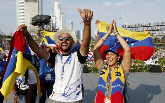 Young people cheer as they wait for Pope Francis' arrival at a welcoming ceremony and gathering with young people at Santa María la Antigua Field in Panama City Jan. 24. (CNS/Paul Haring)