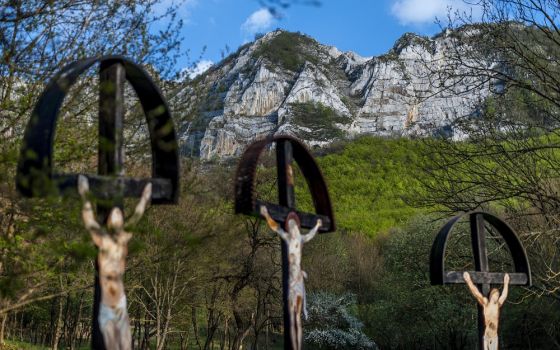 Crucifixes are seen near a closed limestone mine near Belapatfalva, Hungary.