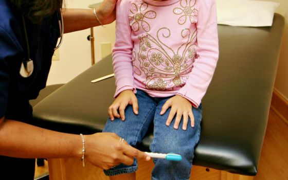 Child at the doctor's office (Dreamstime/Rmarmion)