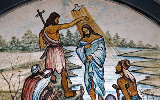 The baptism of the Lord is depicted in stained glass at the Cathedral of Immaculate Heart of Mary and St. Teresa of Calcutta in Baruipur, West Bengal, India. (Dreamstime/Zatletic)