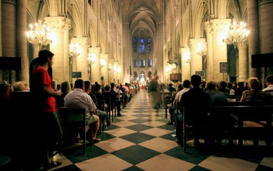 Evening Mass is celebrated in this file photo taken at Notre Dame Cathedral in Paris. (Dreamstime/Ruben Gutierrez)