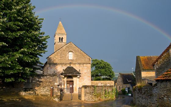 A rainbow is seen at the Taizé community's Ste. Marie Madeleine Church in Burgundy, France. Brother Roger Schutz was the founder of the community. (Dreamstime/Farmer)