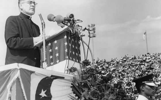 Holy Cross Fr. Theodore Hesburgh speaks at the Illinois Rally for Civil Rights in Chicago in 1964. (OCP Media)