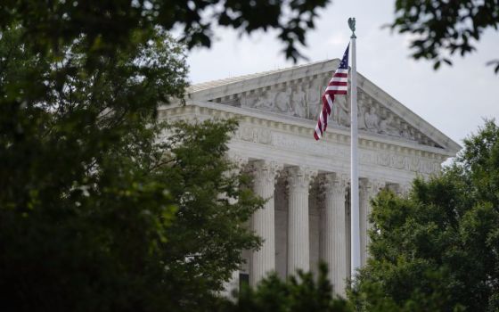 An American flag waves in front of the U.S. Supreme Court building, June 27, 2022, in Washington. (AP/Patrick Semansky)