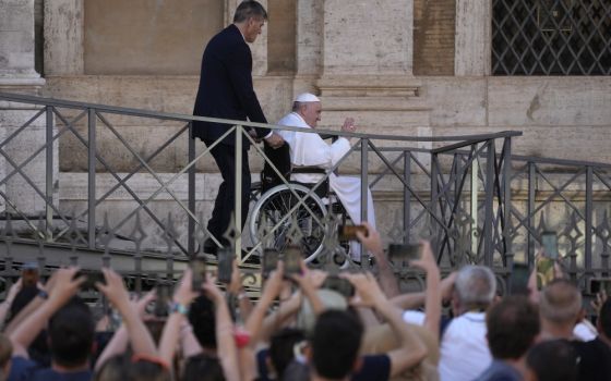 Pope Francis greets the faithful as he leaves St. Mary Major Basilica after participating in a rosary prayer for peace, in Rome, May 31. (AP/Gregorio Borgia)