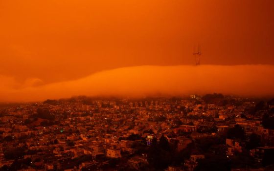 San Francisco is seen around noontime on Sept. 9, 2020, as wildfires in the Pacific Northwest turned the sky an ominious orange haze, and blanketed the city in darkness. (Unsplash/Patrick Perkins)