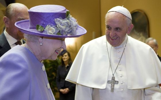 Britain's Queen Elizabeth II talks with Pope Francis during a meeting at the Vatican in this April 3, 2014, file photo. 
