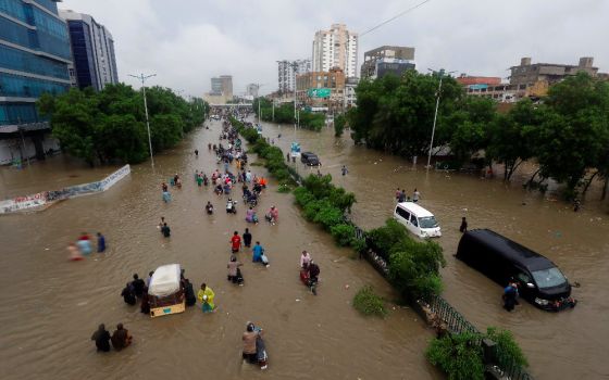 Climate change increases the likelihood of extreme weather, like the rains that caused this flooding in Karachi, Pakistan, in late August 2020. (CNS photo/Akhtar Soomro, Reuters)
