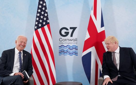 U.S. President Joe Biden laughs while speaking with British Prime Minister Boris Johnson on June 10 ahead of the Group of Seven summit. (CNS/Reuters/Kevin Lamarque)