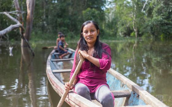 Liz Chicaje Churay paddles a canoe near her home on the Ampiyacu River in Peru's northeastern Loreto region. (Goldman Environmental Prize)