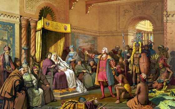 An illustration shows Christopher Columbus standing before the king and queen of Spain, presenting Indians and treasures from the New World in 1493 in Barcelona. (Newscom/World History Archive)