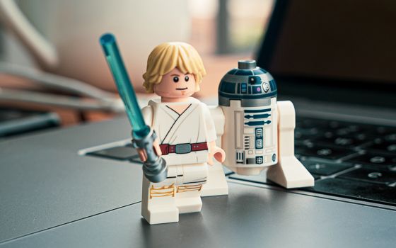 Lego "Star Wars" minifigures Luke Skywalker and R2-D2 are pictured. In "Star Wars," Luke receives a lightsaber at Obi-Wan Kenobi's hut on the planet Tatooine. Eric Clayton reflects on building a Lego set of the hut with his daughter. (Unsplash/Studbee)