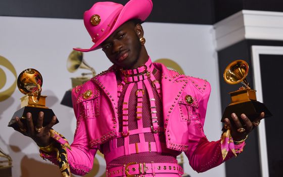 Lil Nas X appears backstage with his awards for Best Pop Duo/Group Performance for "Old Town Road" and Best Music Video for "Old Town Road (Official Movie)," during the 62nd annual Grammy Awards held at Staples Center Jan. 26, 2020, in Los Angeles. (Newsc