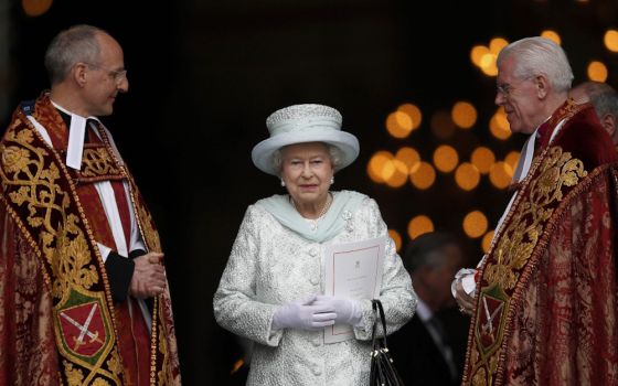 Britain's Queen Elizabeth II smiles as she leaves St. Paul's Cathedral with the Revs. David Ison and Michael Colclough following a thanksgiving service to mark her diamond jubilee in London June 5, 2012. (CNS/Reuters/Andrew Winning)